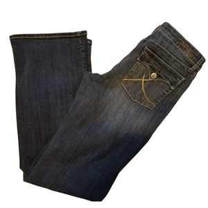 Common Genes bootcut flap back pocket jeans